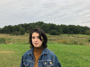 photo of maile young against a green field